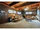 Wood-paneled living room with a wood burning stove at 1101 N Valencia Ave, Howey In The Hills, FL 34737