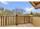 Balcony with wood railing offers neighborhood views and a serene outdoor space at 11507 Center Lake Dr, Windermere, FL 34786