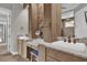 Elegant bathroom vanity with dual sinks, marble countertops, and stylish gray tiled flooring at 11507 Center Lake Dr, Windermere, FL 34786