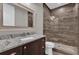 Modern bathroom with a granite countertop vanity and a wood tiled shower stall at 11507 Center Lake Dr, Windermere, FL 34786