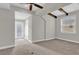 Bright bedroom featuring carpet floors, a ceiling fan, and a door to a small balcony at 11507 Center Lake Dr, Windermere, FL 34786