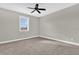 Cozy bedroom with a window offering natural light and neutral carpet at 11507 Center Lake Dr, Windermere, FL 34786