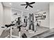 Spacious gym with various fitness equipment, mirrors, and motivational wall art at 11507 Center Lake Dr, Windermere, FL 34786