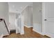 Hallway with wood flooring, white banister, and modern lighting fixtures at 11507 Center Lake Dr, Windermere, FL 34786