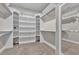 Spacious walk-in closet with custom built-in shelving and ample storage space at 11507 Center Lake Dr, Windermere, FL 34786