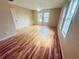 Bright bedroom with hardwood flooring, natural light streaming through the windows at 14410 Sw 79Th Ter, Ocala, FL 34473