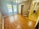 Cozy bedroom featuring wood floors, closet, neutral tones, and natural light from double windows at 14410 Sw 79Th Ter, Ocala, FL 34473