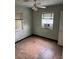 Bedroom featuring natural light, and dated flooring at 1805 Riley Ave, Orlando, FL 32805