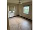 Bedroom featuring natural light, fan and dated flooring at 1805 Riley Ave, Orlando, FL 32805