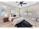 Bright bedroom with ample natural light, wood-look flooring, and a modern ceiling fan at 1809 Simonton Ave, Orlando, FL 32806