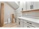 A modern laundry room features bright cabinets and counter space at 1809 Simonton Ave, Orlando, FL 32806