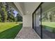 Outdoor patio area with brick flooring, a grassy yard, and sliding glass doors at 1809 Simonton Ave, Orlando, FL 32806