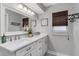 Elegant bathroom with double vanity, marble countertops, and modern fixtures, providing a spa-like experience at 207 Pembrook Pl, Longwood, FL 32779