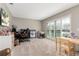 Bedroom featuring neutral paint, a large window, and a desk area offering versatile space for work or relaxation at 207 Pembrook Pl, Longwood, FL 32779