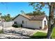 Exterior view of the house showing the driveway, garage, yard with trees, and a fence at 207 Pembrook Pl, Longwood, FL 32779