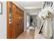 Inviting foyer featuring tile flooring, paneled doors, and an open view to the dining area at 207 Pembrook Pl, Longwood, FL 32779