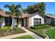 Charming home featuring stone accents, a well-manicured lawn, and inviting curb appeal at 207 Pembrook Pl, Longwood, FL 32779