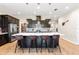 This kitchen showcases a large center island, pendant lighting, and stylish barstool seating at 2212 Antilles Club Dr, Kissimmee, FL 34747