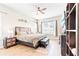 Bright main bedroom featuring a large window, modern furnishings, and a ceiling fan at 2212 Antilles Club Dr, Kissimmee, FL 34747