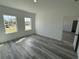 Bright bedroom featuring gray flooring and natural light from the two windows at 2293 Sw 178Th Lane Rd, Ocala, FL 34473