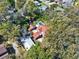 Aerial view of the property highlighting its mature trees, pool, playground, and lot boundary at 234 N Lakeview Ave, Winter Garden, FL 34787