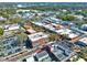 Aerial view of mixed-use buildings in downtown with parking lots and neighborhood trees at 234 N Lakeview Ave, Winter Garden, FL 34787