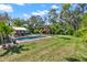 Beautiful backyard with a pool, outdoor dining, and playground, perfect for entertaining at 234 N Lakeview Ave, Winter Garden, FL 34787