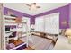 Bright and colorful bedroom with a bunk bed, desk area, and natural light from the windows at 234 N Lakeview Ave, Winter Garden, FL 34787