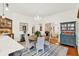 Bright dining room with wood floors, chandelier, and access to the living room, great for entertaining at 234 N Lakeview Ave, Winter Garden, FL 34787