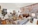 Open living room featuring hardwood floors, neutral sofa and accent wall with world map at 234 N Lakeview Ave, Winter Garden, FL 34787