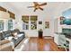 Cozy living room featuring hardwood floors, a comfortable sofa, and a view to the outdoors at 234 N Lakeview Ave, Winter Garden, FL 34787