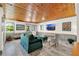 Inviting living room with wood-paneled ceiling, comfortable seating, and natural light at 234 N Lakeview Ave, Winter Garden, FL 34787