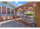 Outdoor patio featuring a built-in grill, dining area and a brick paved pathway at 234 N Lakeview Ave, Winter Garden, FL 34787