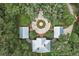 Aerial view of a home featuring a circular driveway and three outbuildings at 2525 Cr 543, Sumterville, FL 33585