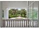 Open doorway with an inviting view of the tree-lined property and meticulously manicured front yard at 2525 Cr 543, Sumterville, FL 33585