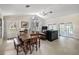 Open-concept living and dining area with a vaulted ceiling, tiled floors and abundant natural light at 2525 Cr 543, Sumterville, FL 33585