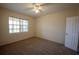 Comfortable bedroom with neutral carpet, ceiling fan and natural light at 2600 Robert Trent Jones # 934, Orlando, FL 32835