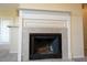 Elegant fireplace featuring a white mantle and neutral-colored tiles, adjacent to an open living area at 2600 Robert Trent Jones # 934, Orlando, FL 32835