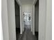 Hallway view to modern bathroom featuring a double vanity with white cabinets and black fixtures at 2703 Sw 162Nd Street Rd, Ocala, FL 34473