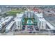 An aerial view displays a U-shaped condominium building with a pool and parking area in a coastal community at 2727 N Atlantic Ave # 2020, Daytona Beach, FL 32118