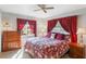 Comfortable bedroom featuring matching wood nightstands, a ceiling fan, and bright, natural light at 29 Jasmine Dr, Debary, FL 32713