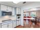 Well-lit kitchen with a breakfast bar that leads to a dining area and living room at 29 Jasmine Dr, Debary, FL 32713