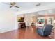 Comfortable living room with hardwood floors, a fireplace, and plenty of natural light at 29 Jasmine Dr, Debary, FL 32713