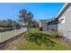 Beautiful back yard with a waterfront view, white fence and lush green grass at 300 Stonington Way, Deland, FL 32724