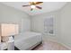 Bedroom with a ceiling fan, shuttered window and tile floors at 300 Stonington Way, Deland, FL 32724