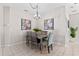 Dining room features decorative chandelier and tropical artwork at 300 Stonington Way, Deland, FL 32724