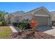 Charming single-story home with a well-manicured lawn and neutral color scheme at 300 Stonington Way, Deland, FL 32724