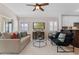 Comfortable living room with neutral colors and decor, ceiling fan, and tile floors at 300 Stonington Way, Deland, FL 32724