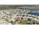 Aerial view of single-Gathering home with pool, fenced yard, and mature trees surrounded by a suburban neighborhood at 3223 Queen Alexandria Dr, Kissimmee, FL 34744