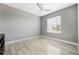 Empty bedroom featuring a single window and light-colored wood floors at 3223 Queen Alexandria Dr, Kissimmee, FL 34744